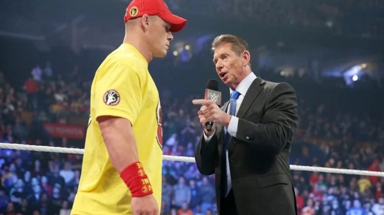 Vince McMahon cuts a promo on John Cena in the ring during an episode of WWE programming.