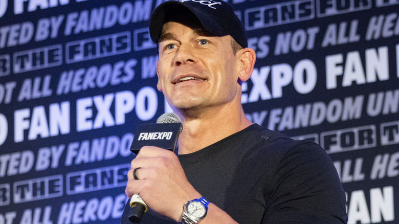 John Cena is holding a microphone