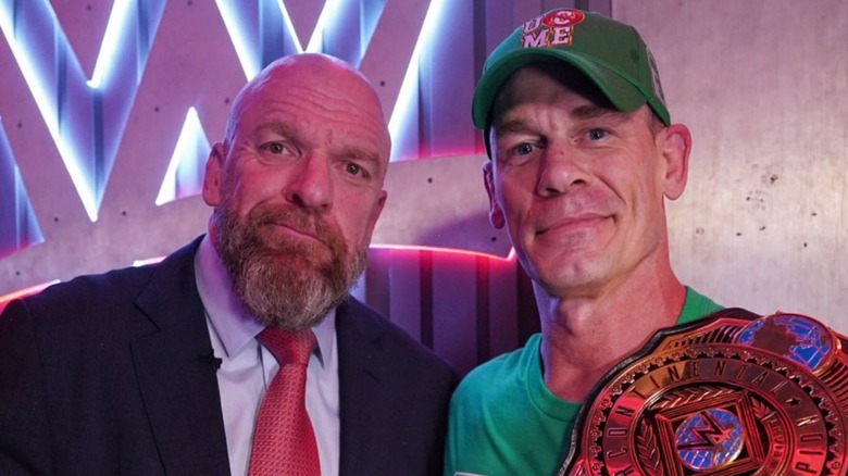 Triple H poses with John Cena backstage