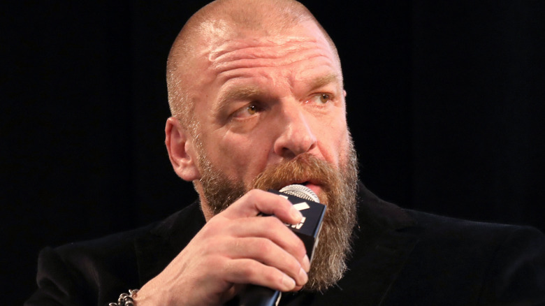 Triple H speaks onstage at Featured Session: The Women's Evolution in WWE
