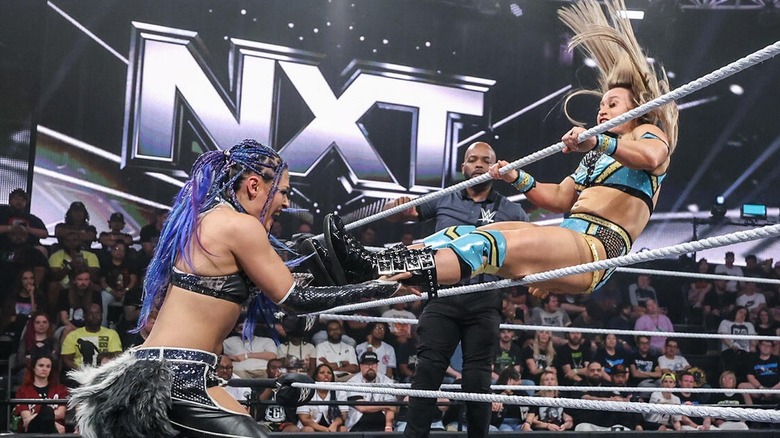 Jordynne Grace attempts to connect a kick between the ropes on Giulia