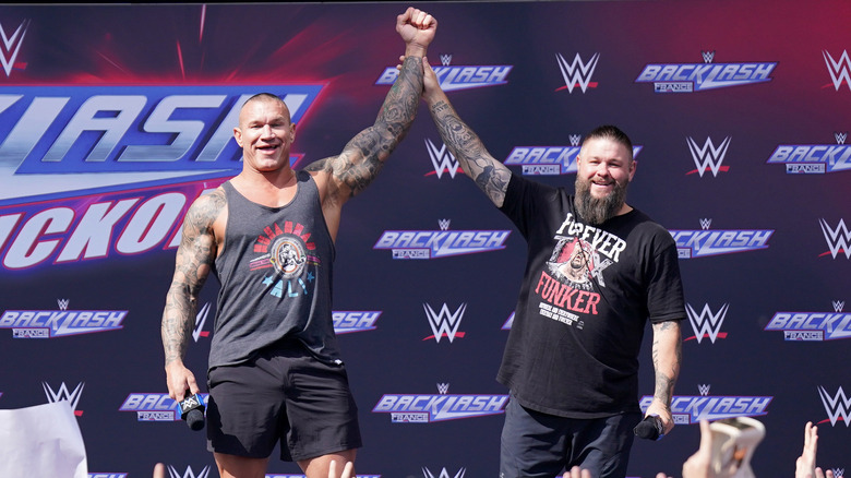 Kevin Owens raises Randy Orton's hand