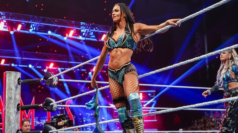 WWE star Kiana James poses on the apron before getting in the ring for a match on 