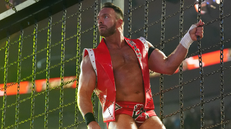 LA Knight hanging onto the chains at WWE Elimination Chamber