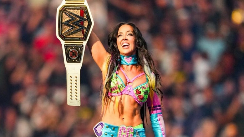 Chelsea Green celebrating with the WWE Women's Championship.