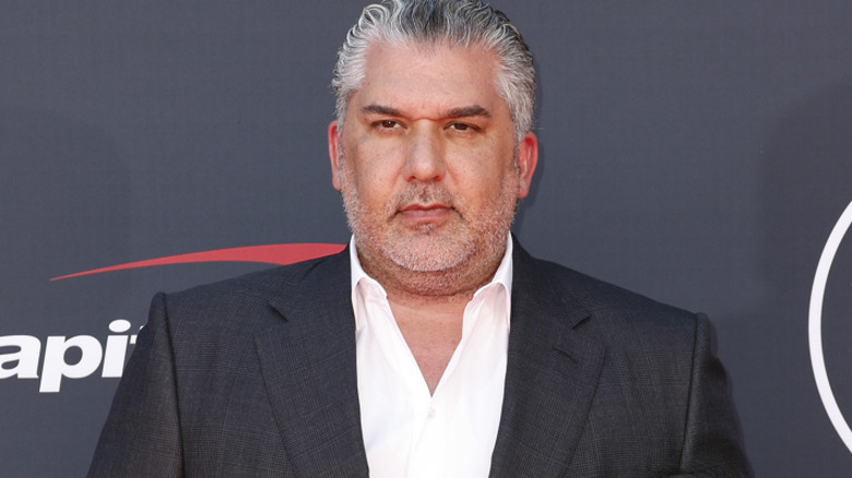 Nick Khan wearing a suit