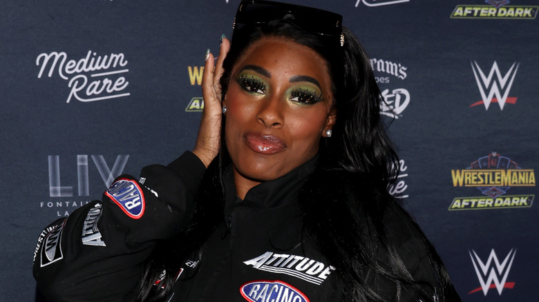 Lash Legend wearing sunglasses on her head