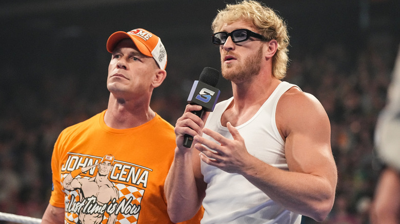John Cena and Logan Paul standing beside one another