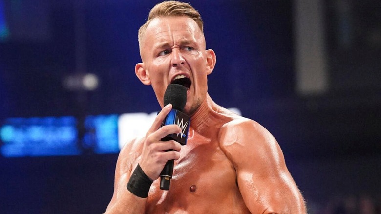 WWE star Ludwig Kaiser cuts a promo as he gets into the ring during an episode of 