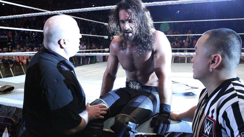Seth Rollins talking to medical professionals after tearing his ACL and being helped out the ring. "NXT," 2015.
