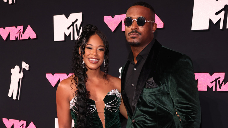 Montez Ford and Bianca Belair posing on the red carpet 