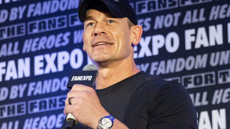 John Cena is holding a microphone