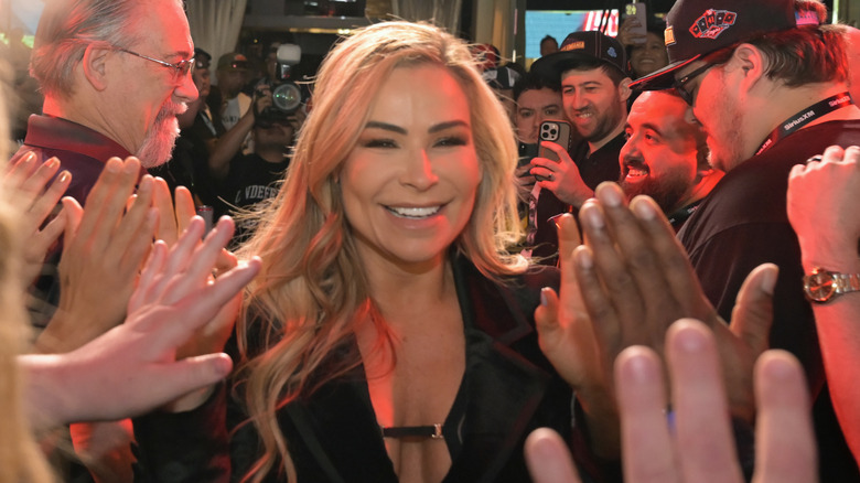 Natalya walking her way through the crowd