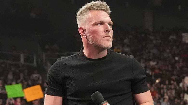 Pat McAfee holding a microphone