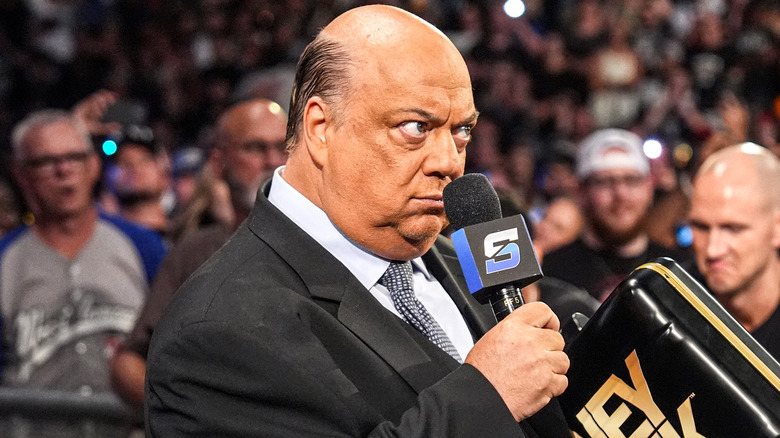 Paul Heyman on WWE TV holding a microphone