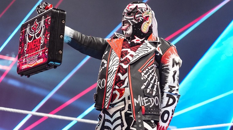 Penta holding up the briefcase