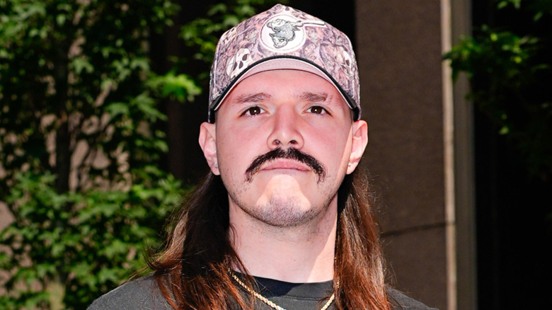 Dominik Mysterio walking in public with the WWE intercontinental Championship. New York City, August 2025.