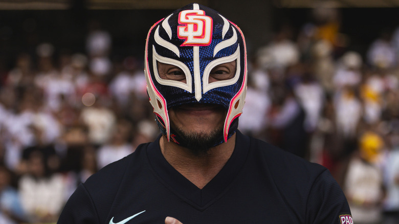 Rey Mysterio stands on the field before the MLB Mexico City Series game between the San Diego Padres and the Arizona Diamondbacks, Mexico City. April 2026.