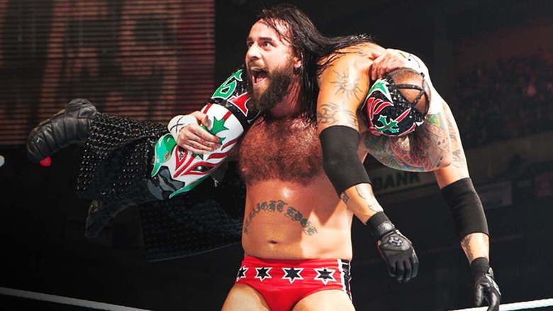 CM Punk hoisting Rey Mysterio over his shoulders for his GTS finisher during their feud.