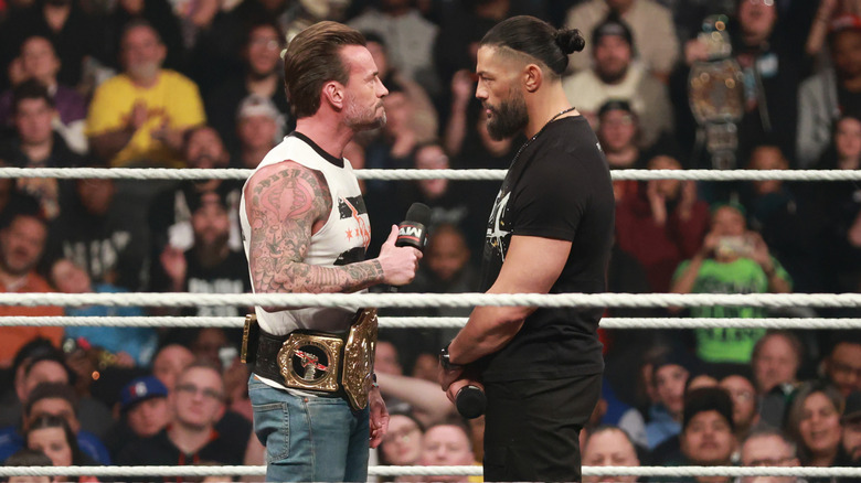 CM Punk and Roman Reigns getting ready to call each other old