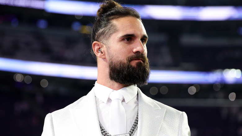 Seth Rollins wearing a white shirt and blazer