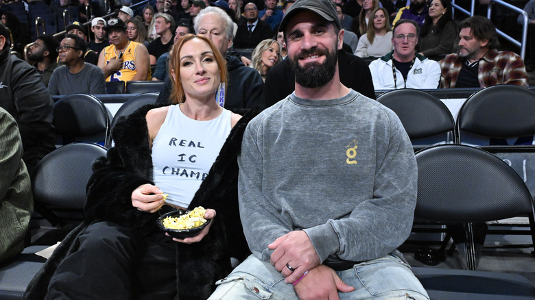 Becky Lynch & Seth Rollins attending a game