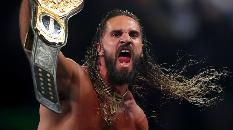 Seth Rollins holding the WWE World Heavyweight Championship