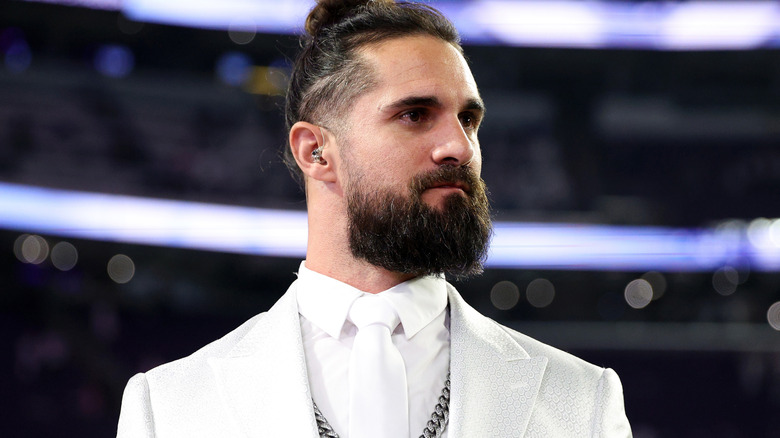 Seth Rollins wearing a white shirt and blazer