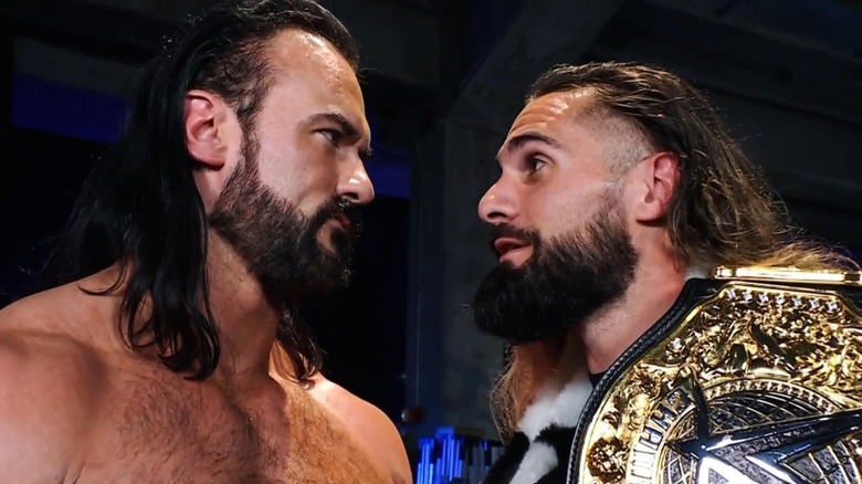 Drew McIntyre and Seth Rollins stare each other down