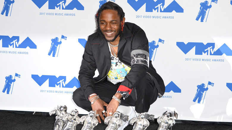Kendrick Lamar poses with six MTV Video Music Awards