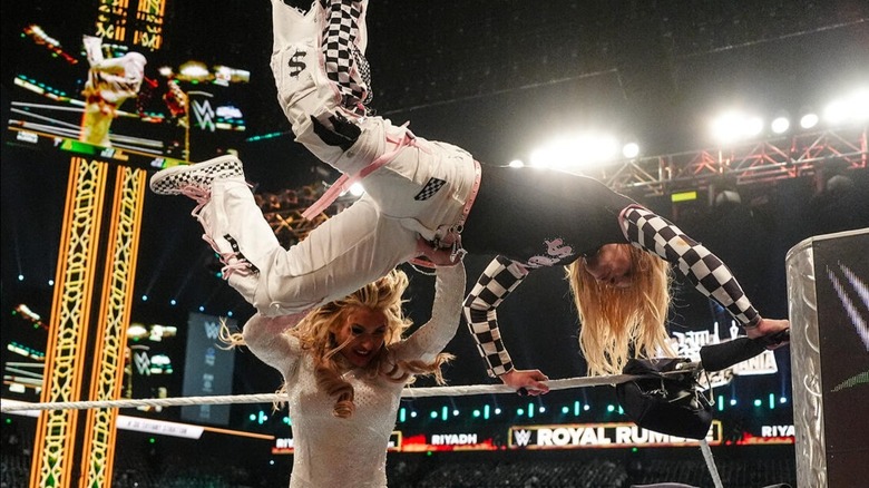 Sol Ruca attempts a Sol Snatcher on the outside apron before Tiffany Stratton blocks the move and eliminates her from the 2026 Women's Royal Rumble match