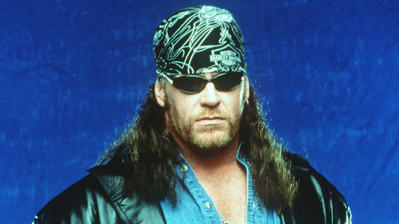 Biker Undertaker in sunglasses and Harley Davidson bandana