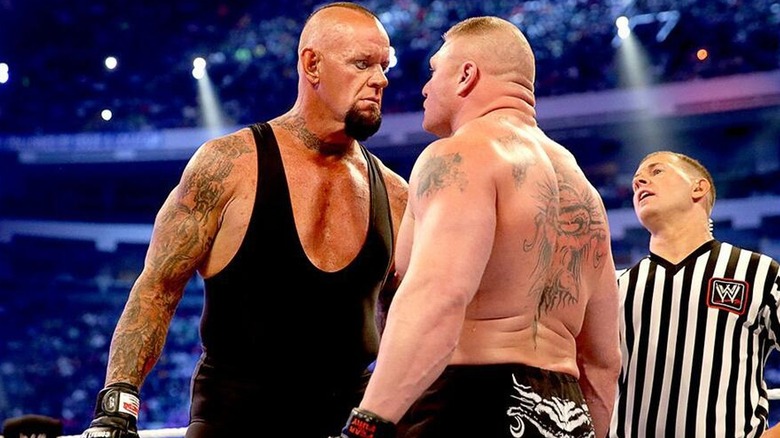 The Undertaker and Brock Lesnar staring one another down during their WrestleMania 30 match.