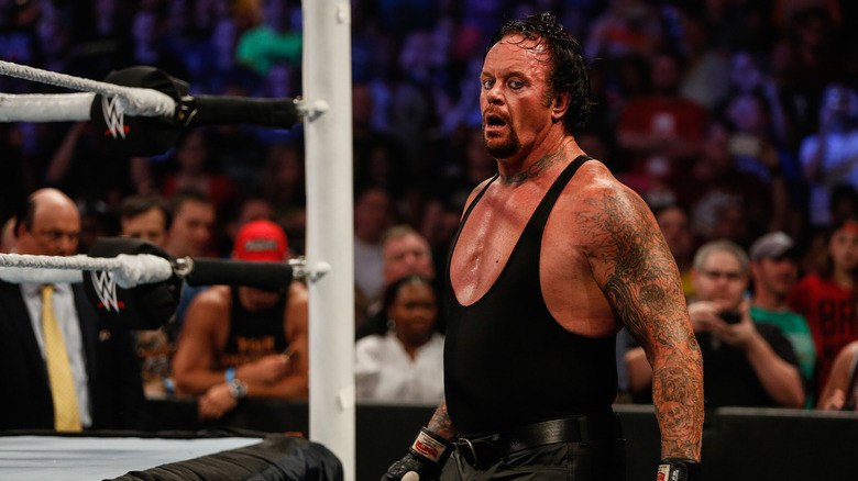 The Undertaker recovers during a match