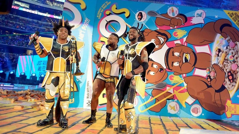 Xavier Woods, Big E, and Kofi Kingston, the New Day, cut a promo in front of a big box of 