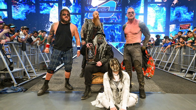 Joe Gacy, Erick Rowan, Uncle Howdy, Nikki Cross and Dexter Lumis of the Wyatt sicks enter the arena during SmackDown at Kingdom Arena on June 27, 2025 in Riyadh, Saudi Arabia