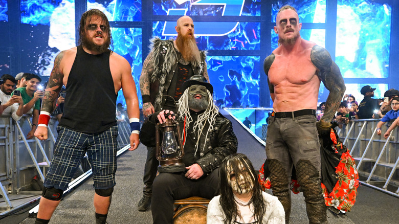 Joe Gacy, Erick Rowan, Uncle Howdy, Nikki Cross and Dexter Lumis of the Wyatt sicks enter the arena during SmackDown at Kingdom Arena on June 27, 2025 in Riyadh, Saudi Arabia