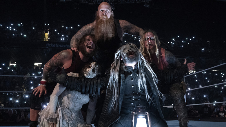 The Wyatt Sicks (Joe Gacy, Nikki Cross, Erick Rowan, Uncle Howdy, and Dexter Lumis) pose in the ring during Monday Night RAW at the CFG Bank Arena on August 5, 2024 in Baltimore, Maryland.