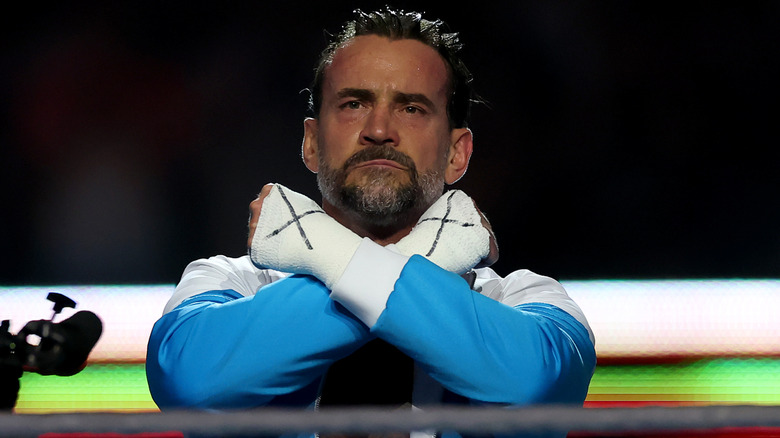CM Punk makes his entrance before the match against Gunther for the WWE World Heavyweight Championship during the WWE 2025 SummerSlam at MetLife Stadium on August 02, 2025 in East Rutherford, New Jersey.