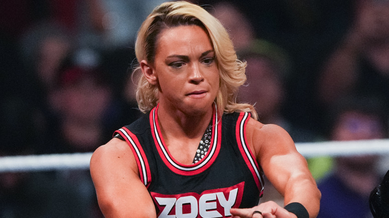 Zoey Stark wearing a red and black tank top