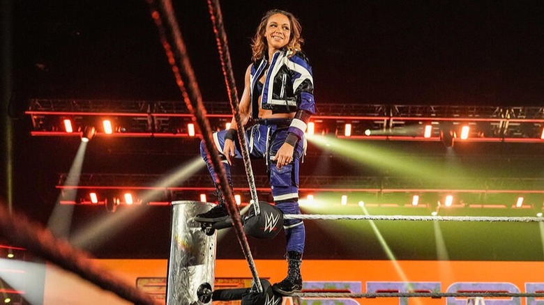 Zoey Stark stands on the middle and top rope before her WWE match