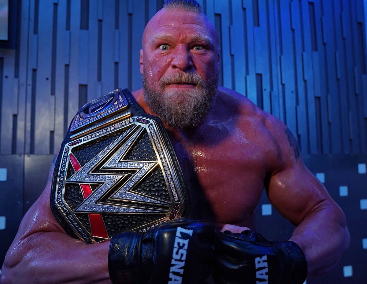 brock lesnar holding the wwe title